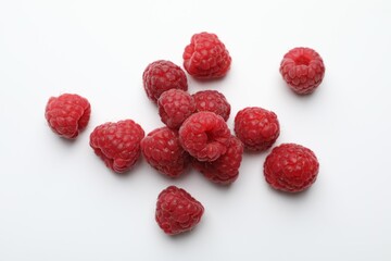 Tasty fresh ripe raspberries on white background, flat lay
