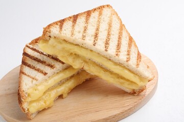 Tasty sandwiches with melted cheese on white table, closeup