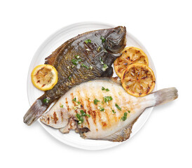 Tasty roasted flounder fish with herbs and lemon slices isolated on white, top view. Homemade seafood dish
