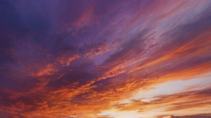 Fototapeta premium A breathtaking sunset, displaying vibrant hues of orange, purple, and blue in the sky.