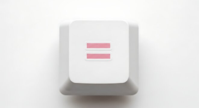 Close-up of equals key on white keyboard