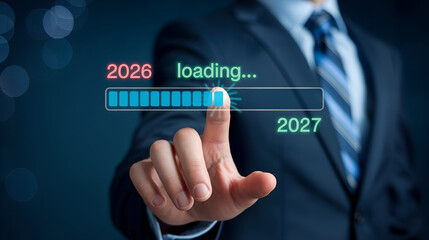 Businessman touching a loading bar transitioning from 2026 to 2027