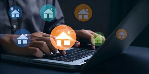 Person's hands typing on laptop with glowing house icons floating around computer