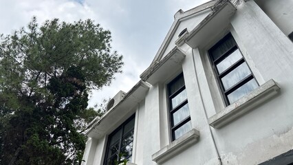 White Classic Building Facade with Tree