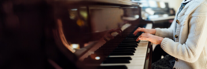 Child Playing Piano Wide Banner with Copy Space © Аrtranq
