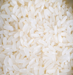 Close up of uncooked white rice grains background