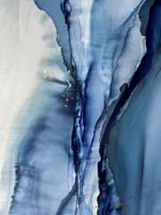 Abstract blue background with gold &mdash; fluid art texture made with alcohol ink and golden potal. Beautiful smudge and stains. Blue with purple natural art backdrop resembles watercolor or aquarelle.