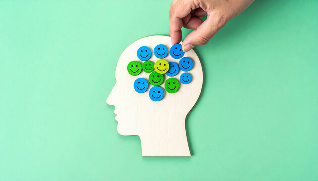 Hand Filling Silhouette Head with Happy Face Tokens