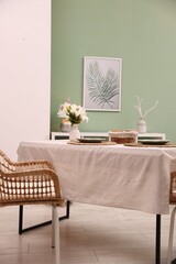 Stylish table with chair and decor in dining room. Interior design