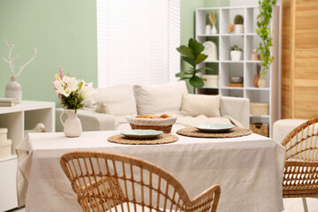 Stylish table with chairs and decor in dining room. Interior design
