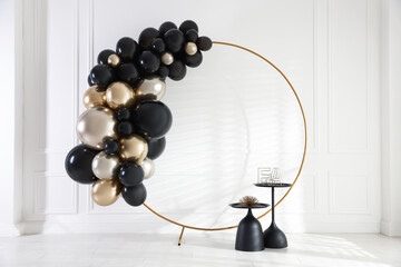 Stylish photo zone with balloons and decor in studio