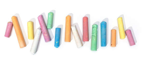 Variety of colored chalk isolated on white background