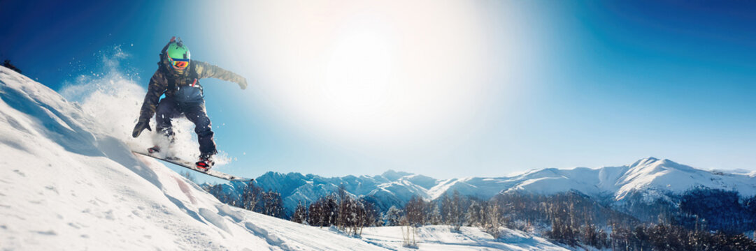 Snowboarder Jumping on Mountain Wide Banner - Powered by Adobe