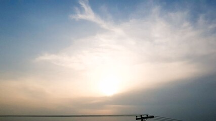 Serene Sunrise Sky: A Peaceful Morning with Golden Light and Wispy Clouds