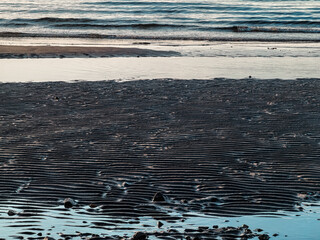 surf waves of clear blue waters of the Arctic Ocean