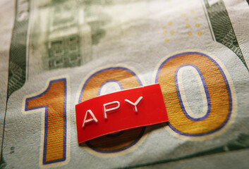 APY - Annual Percentage Yield - label macro on a hundred dollar bill