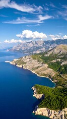 Coastal mountain range with vibrant blue water