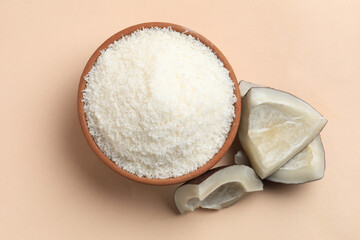 Coconut powder on a cream background