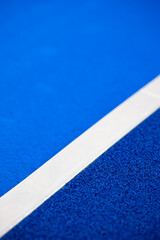 Padel tennis line close up. Outdoors court. Blue surface.