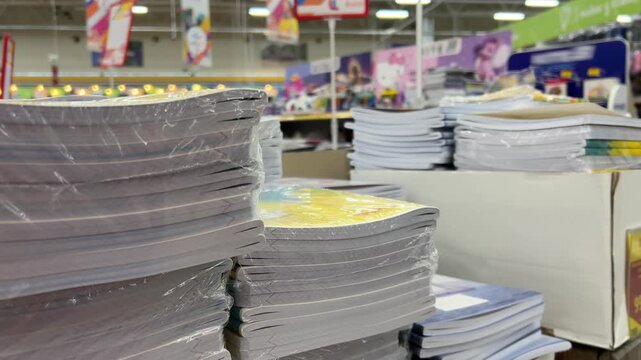 School notebooks stacked on shelves traditional learning supplies back to school preparation