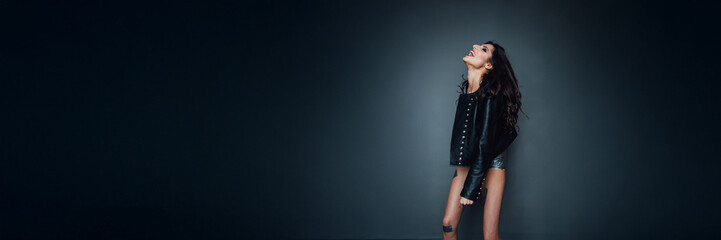 Joyful Woman in Leather Jacket - Wide Banner