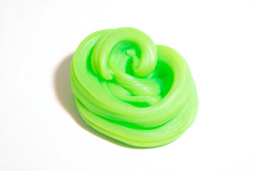 a green spiral shaped object on a white surface