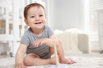 Fototapeta premium Happy little baby on floor in room. Space for text