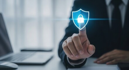 Businessman s finger activates digital shield icon with glowing lock symbol representing data protection and cybersecurity
