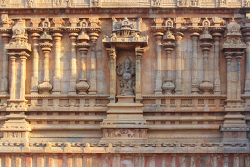 Intricately carved Indian temple sculptures depicting deities, mythological scenes, and ornamental motifs. These traditional stone carvings reflect the rich artistic heritage, spiritual symbolism, and