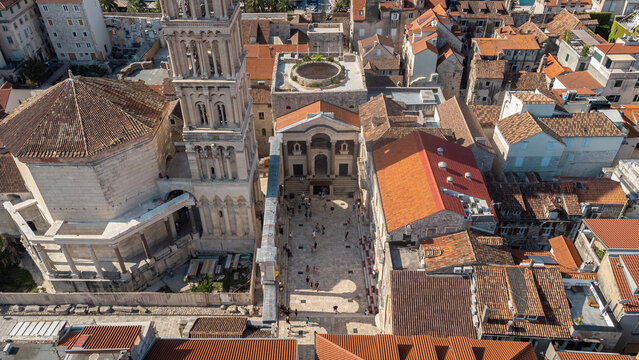Aerial view of Diocletian's Palace, a historic tourist attraction in Split, Croatia. View from above of tourists visiting the historical complex of the city of Split