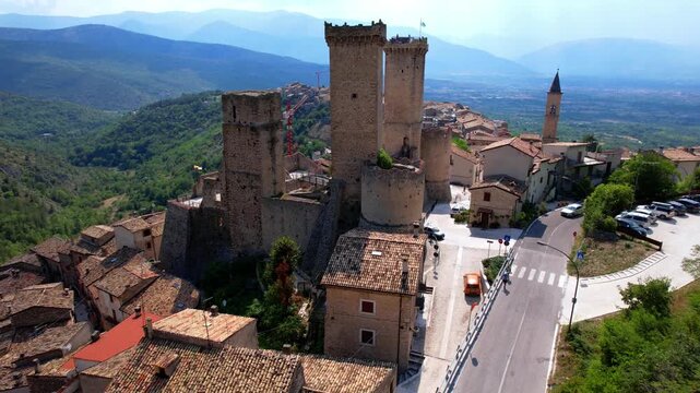 Italy Abruzzo Pacentro aerial drone pullback shot medieval castle and village 4K cinematic mountain landscape scenic historic architecture hidden gem travel footage
