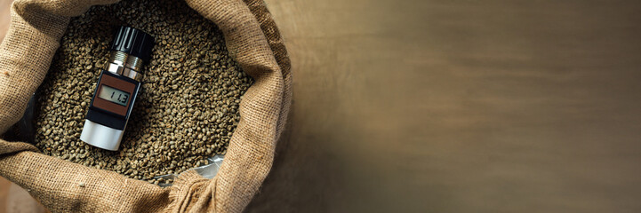 Coffee Moisture Meter on Beans Wide Banner with Copy Space