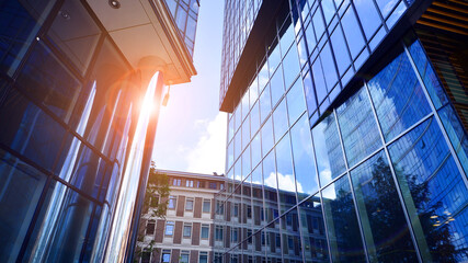 Modern sustainable glass office buildings. Exterior view of corporate headquarters glass buildings architecture.Glass windows in energy-efficient buildings. Financial business center buildings.  © Grand Warszawski