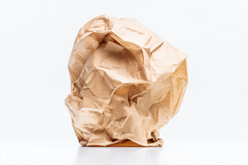 a brown paper bag sitting on top of a white table