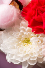Close-up of a beautiful bouquet with chrysanthemums and carnations on a neutral background. Bouquets and flowers. Selective focus.