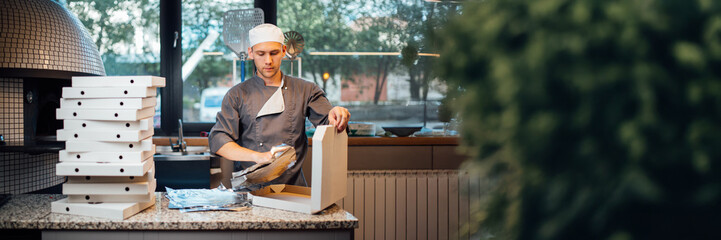 Chef Preparing Pizza Boxes in Wide Banner