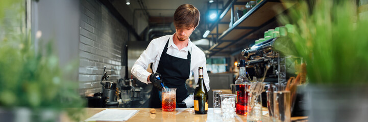 Bartender Mixing Cocktail in Wide Banner