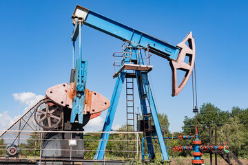 Oil Well Pumpjack pumping crude oil for fossil fuel energy.