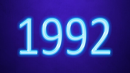Glowing blue number design of 1992 on blue background.
