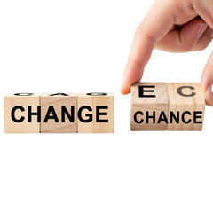 Fingers flip wooden blocks from change to chance symbolizing opportunity and transformation transparent background
