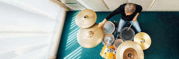 Drummer Playing Set in Studio Wide Banner with Copy Space