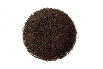 a pile of black tea on a white surface
