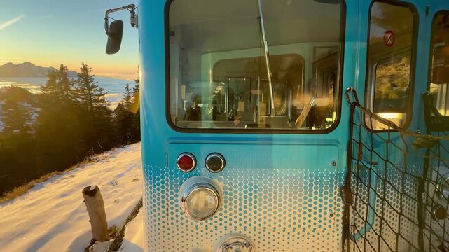 View from the window on the Rigi mountain railway. Switzerland. Magnificent mountain scenery at sunset.