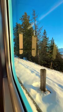 View from the window on the Rigi mountain railway. Switzerland. Magnificent mountain scenery at sunset.