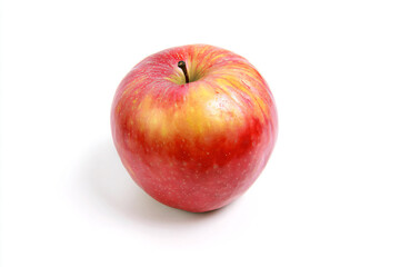 a red apple with a yellow center on a white surface