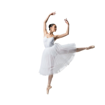 Fototapeta Beautiful ballerina in white tutu performing arabesque ballet dance pose on black background isolated shot on transparent background