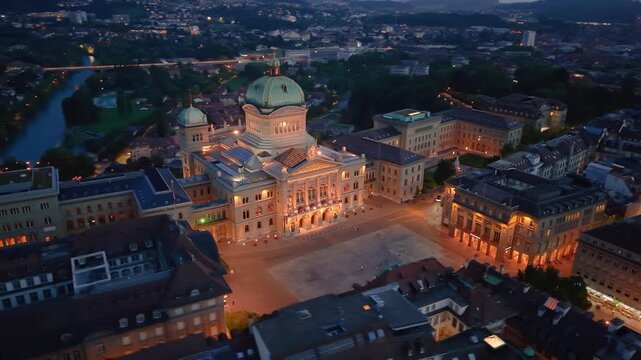 Stunning Aerial View of the Iconic Parliament building Illuminated by Evening Lights and Colors. Bern. Switzerland