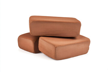 Obraz premium three pieces of clay sitting on top of each other