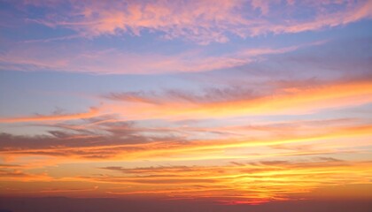 A stunning sunset sky, filled with vibrant hues of orange, pink, and yellow, displays a picturesque array of clouds.