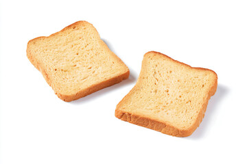 two pieces of bread sitting on top of a white surface